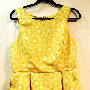 Beautiful yellow pre own dress wore once from Macy and the can't fit anymore.